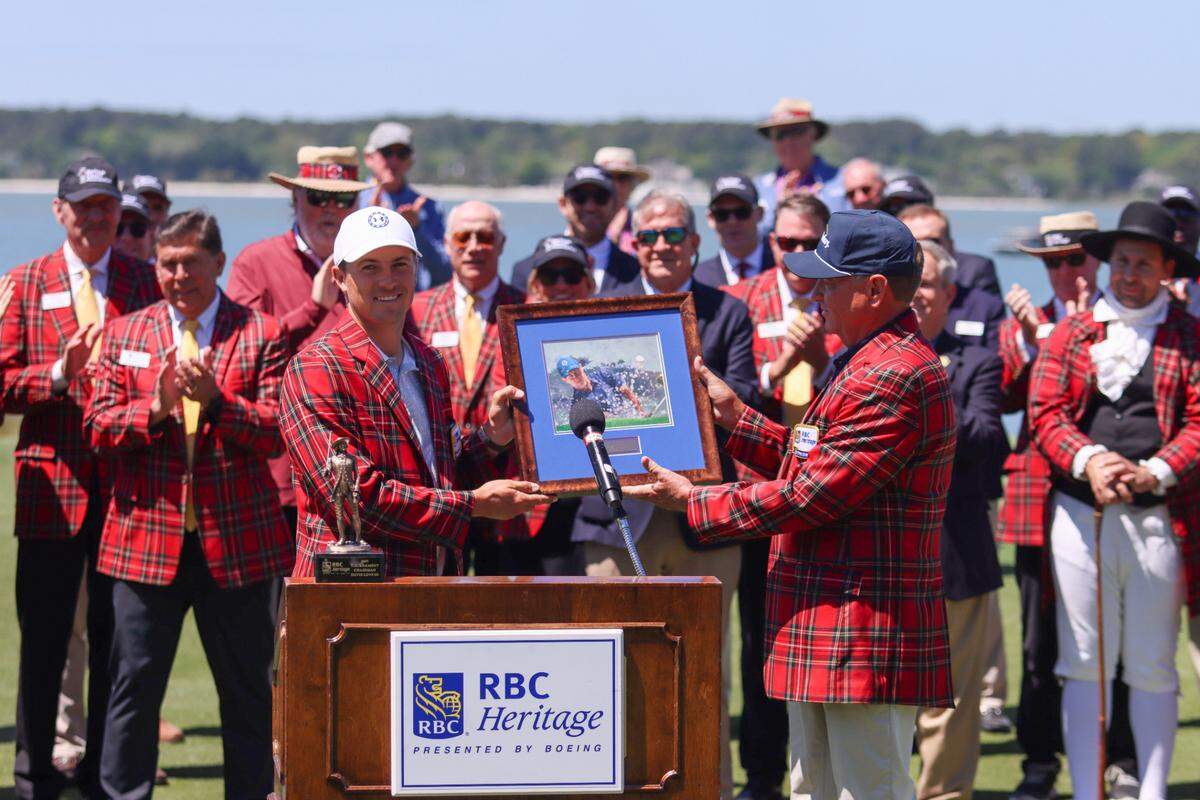 Davis Love III, right, presents a framed print to defending champion Jordan Spieth during the opening ceremony of the 2023 RBC Heritage Presented by Boeing on April 11, 2023 at Harbour Town Golf Links on Hilton Head Island.