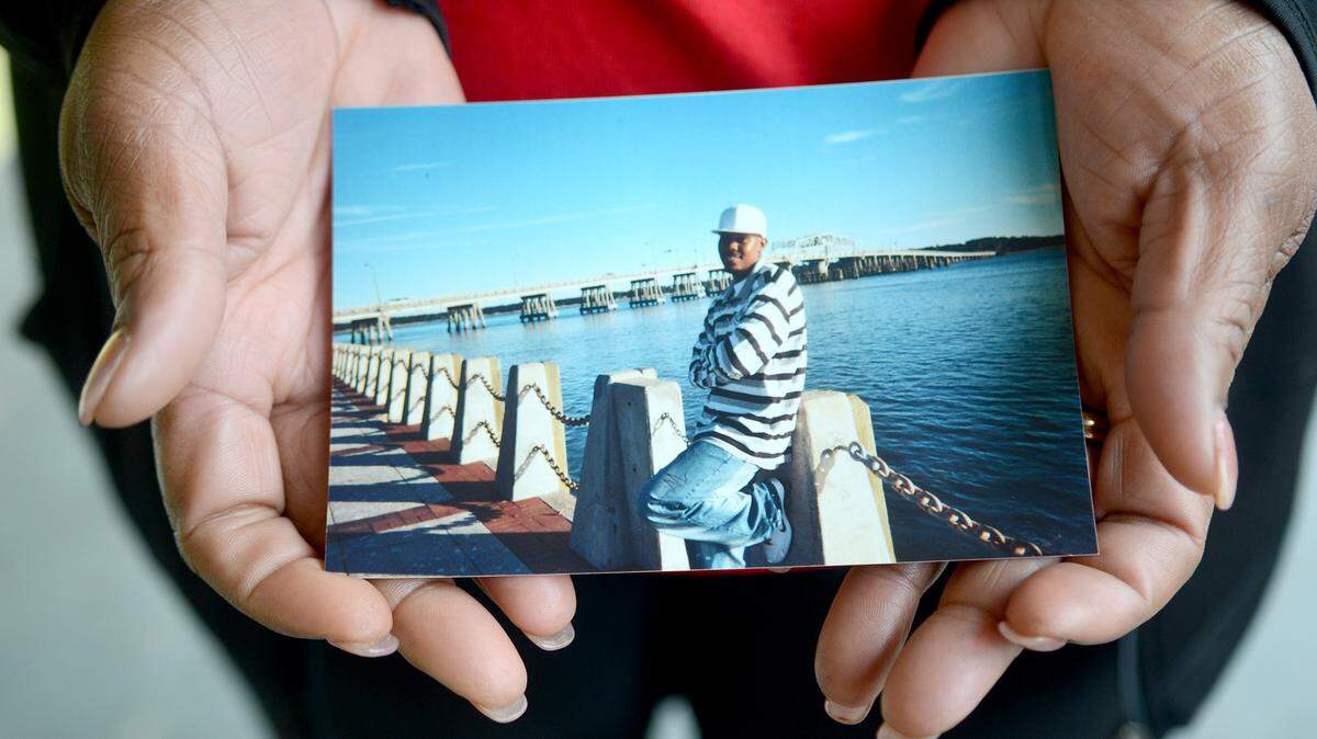 Janice Steve holds a photo of her son, Vermon, at his home on Greene Street, Beaufort, on Nov. 9, 2015. Vermon Steve has been missing since Oct. 25.