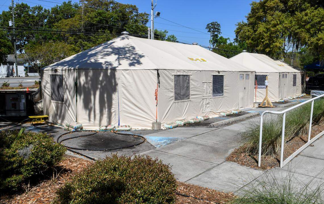 Two tents sit outside the emergency entrance to Beaufort Memorial Hospital as seen on Friday, April 3, 2020 as part of the care for patients experiencing symptoms that could be the coronavirus. Patients experiencing symptoms first go to the emergency entrance. If symptoms indicate they may need to get tested they are taken to the tent, left, to be screened more thoroughly and then to the next tent to be swabbed for Streptococcus or strep, the flu and COVID-19.