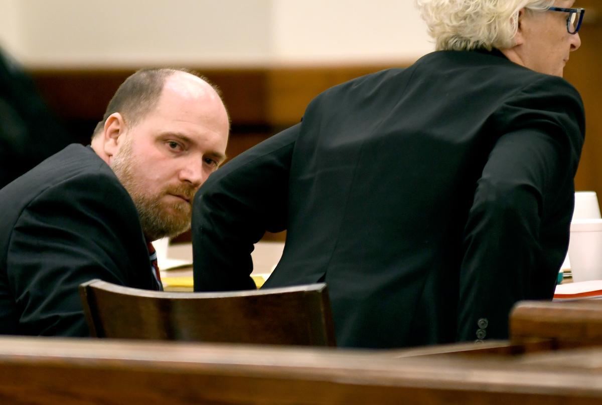 Brian Walls of Burton, SC, sneaks a look on April 10, 2019 at family members and friends of Teresa Seigler, 56, who was found dead in her Bon Aire Estates home in Beaufort County in 2016 as his defense attorney, Trasi Campbell, rises to address the court. Walls was on trial for the murder of Seigler, who was beaten, bound in duct tape and blankets and set on fire.