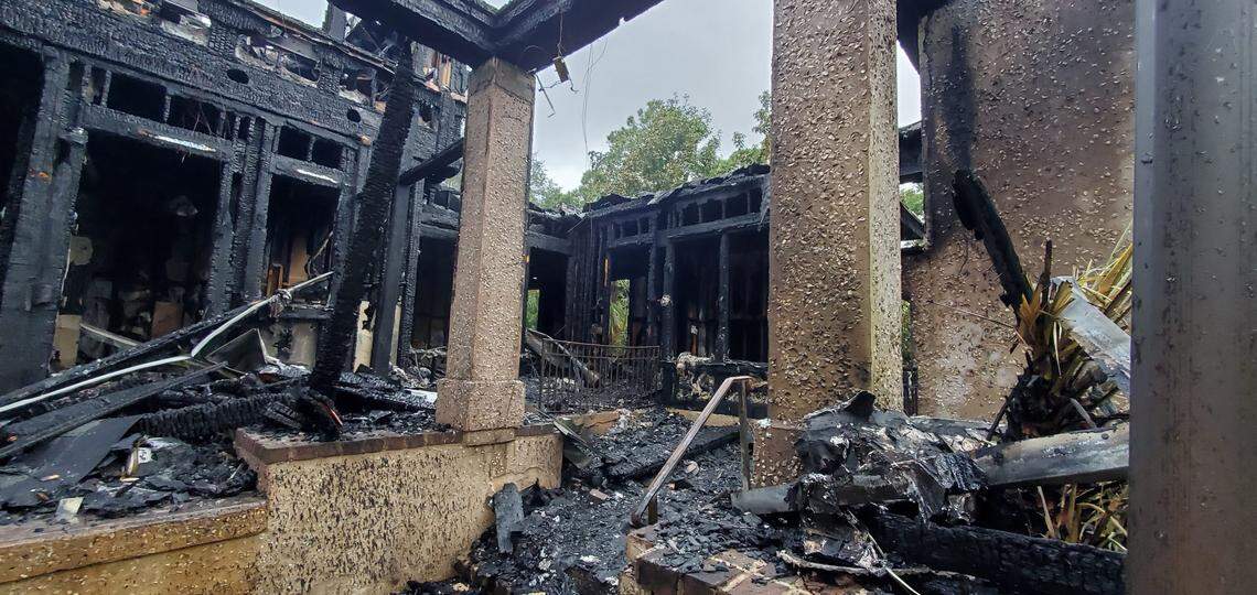 A photo taken Friday morning shows the fire damage to the rental home on Dinghy Lane.