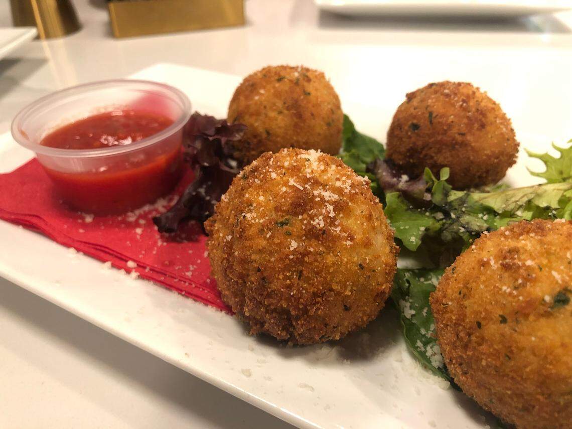 Arancini, risotto with peas and cheese rolled into balls, breaded and fried, served at Mama G’s Pizza Bistro and Bar in Bluffton. 