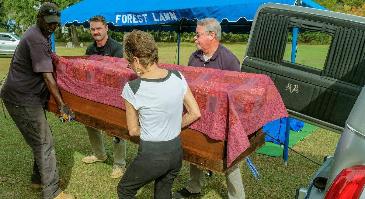 Staff with Forest Lawn Cemetery remove the cremains of unclaimed persons on Thursday, Nov. 18, 2021, that were held by the Beaufort County Coroner’s office. Of the ashes, some of which are unknown, is an identified person who died in 1982. Beaufort County spent $4,884 for the crypt in the cemetery’s mausoleum that can accommodate more cremains as well as the ability for families to claim loved one in the future.