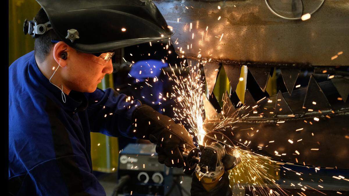 Alex Gruly, an 11th grader at May River High School, works on the mouth of the school's mascot on Friday morning. While the mouth of the shark looks menacing, the sharks' body opens to reveal a grill for cooking. Gruly says the grill, which was started last semester, will be used to cook foods at sporting events. The welding class is part of the Beaufort County School District's Career and Technology Education center curriculum.