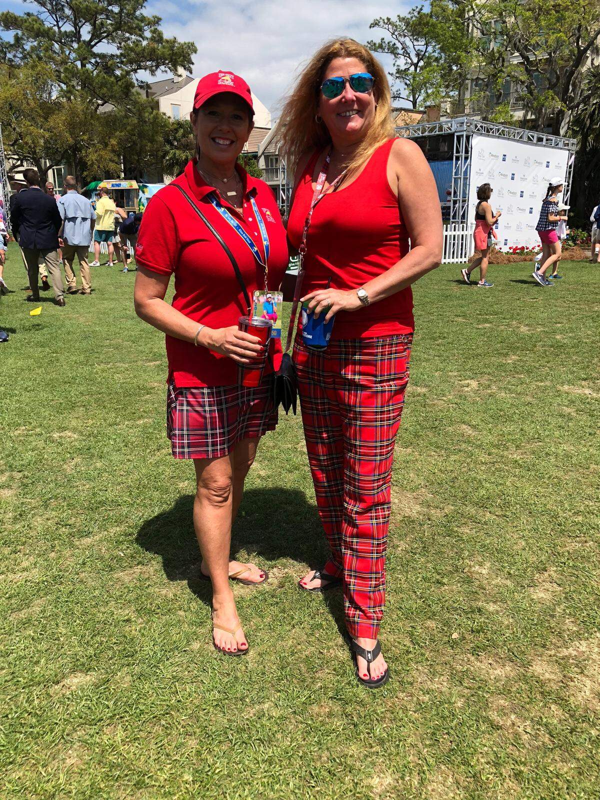 Lesly Crick (L) and Bethanne Carroll dressed in coordinated plaid outfits at the RBC Heritage Golf Tournament on Friday, April 13, 2018.