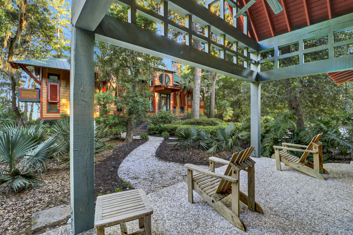 A view of the main home from outside of the guest house found at the 194 Spring Island Drive property in Okatie, SC.