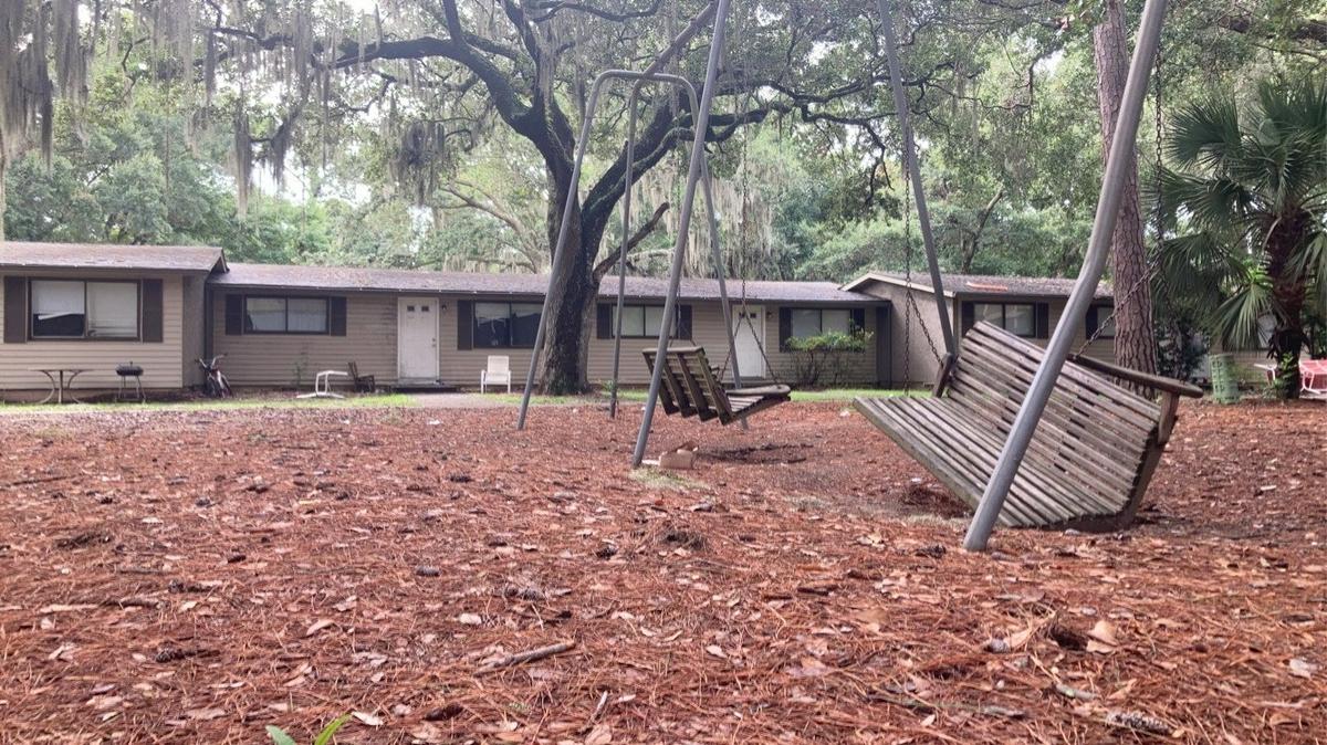 A suspended swing lies halfway on the ground at Chimney Cove. The neighborhood’s roughly 300 tenants, mostly Hispanic islanders, were surprised to find eviction notices on their doors on Aug. 12.