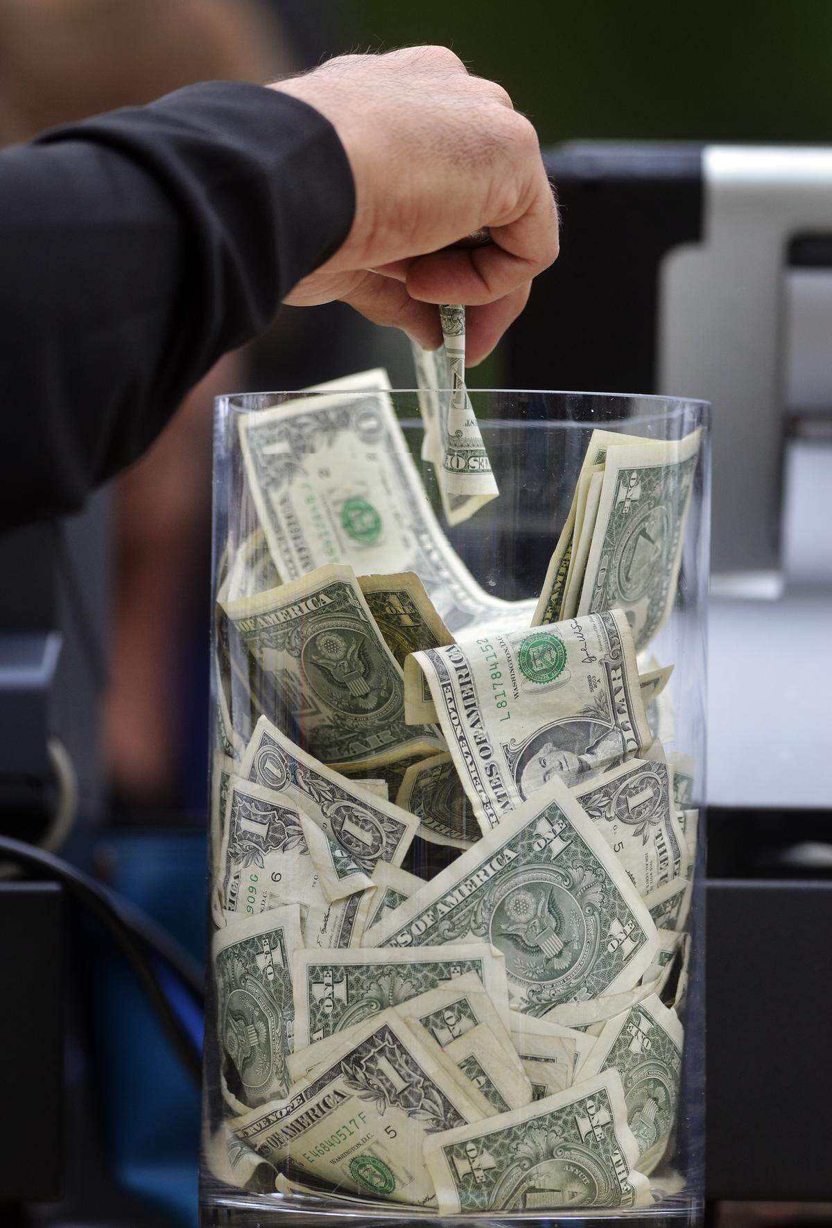 Money being put in to a tip jar at The Clubhouse Deck Bar during the 1st round of the RBC Heritage Presented by Boeing on April 16, 2015, at Harbour Town Golf Links in Sea Pines on Hilton Head Island S.C.