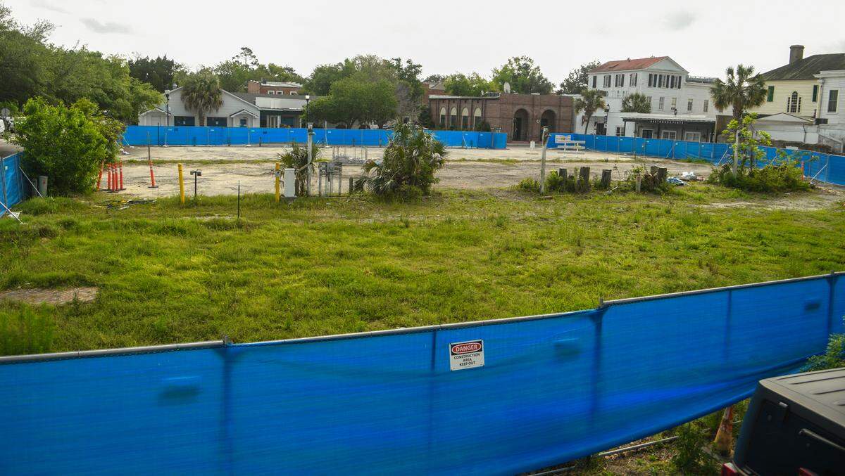 Photographed from an adjacent property on April 7, 2023, fencing surrounds the property owned by Dick Stewart of 303 Associates, where a planned hotel – bounded on the northeast by Port Republic and Scott streets – sits idle in Beaufort’s historic district which has been delayed.