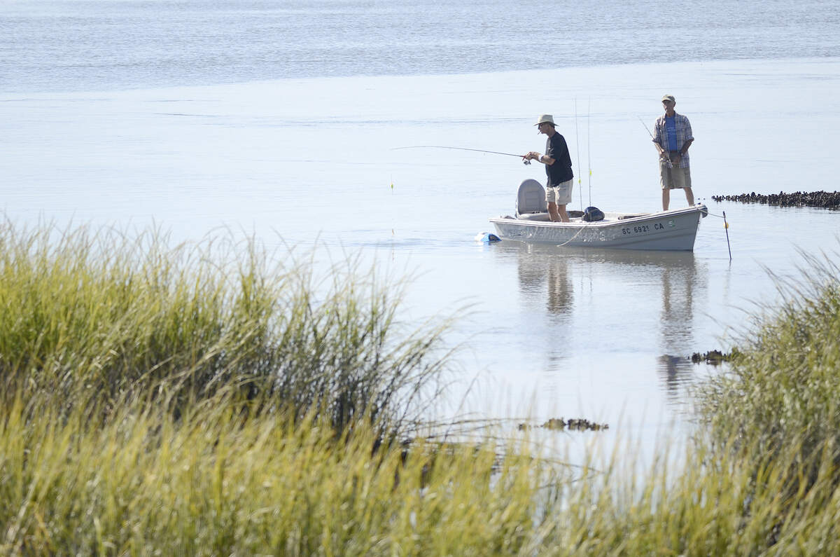 Two fisherman spend the morning fishing on Beaufort River near the Downtown Marina on Monday morning in Beaufort.