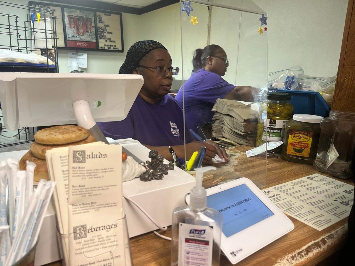 Ronette Grant takes an order Friday morning at Alvin Ord’s Sandwhich Shop in Port Royal. Grant, a 33-year employee, is just one of several employees who have worked at the shop for decades.