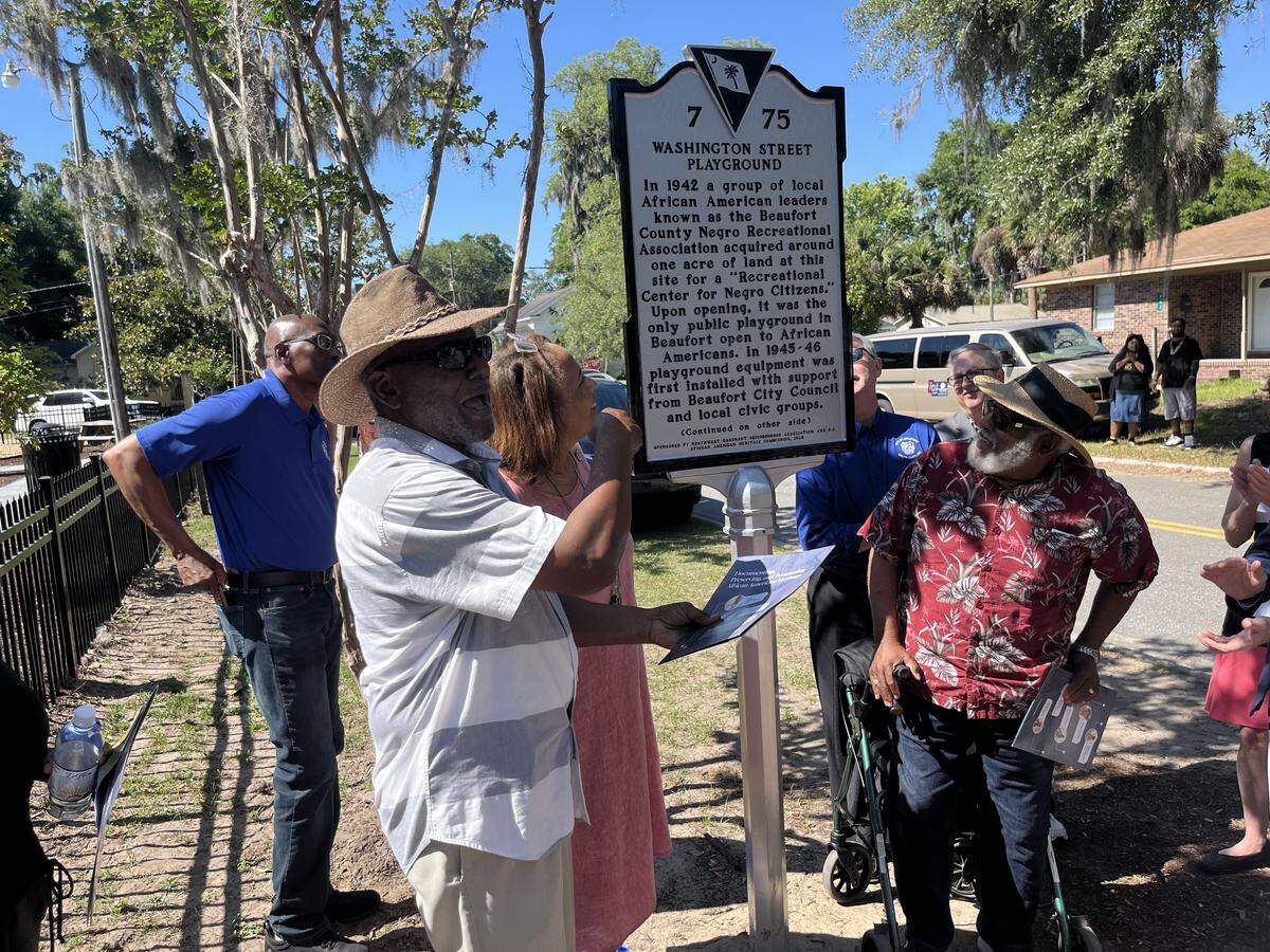 Fred Washington Jr., left, and Ed Allen were among those who spoke Wednesday morning at the unveiling of marker explaining the history of Washington Street Park.