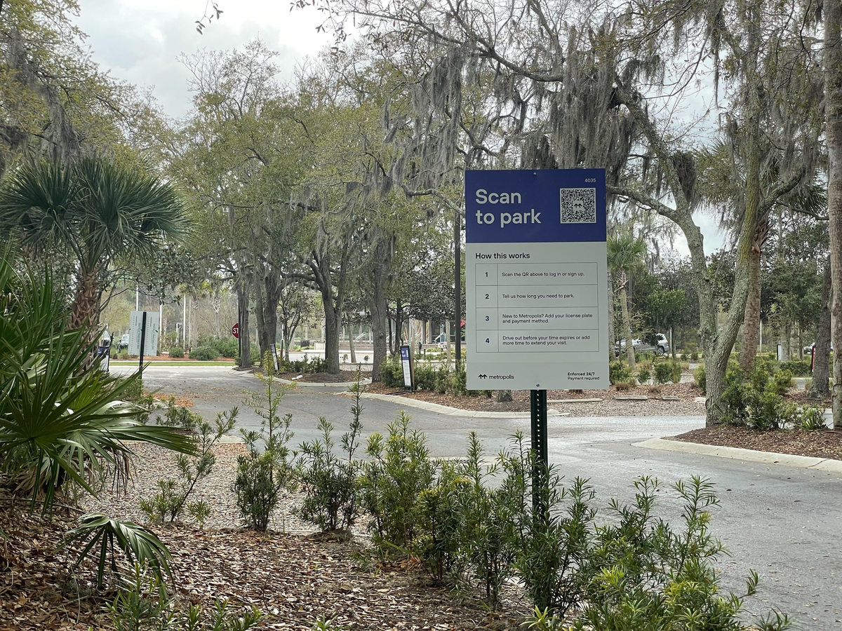 A private company called Metropolis charges people a fee to use the Circle Center shopping plaza parking lot.