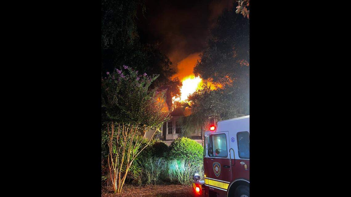 Flames rise from a Palmetto Dunes rental home early Friday morning.