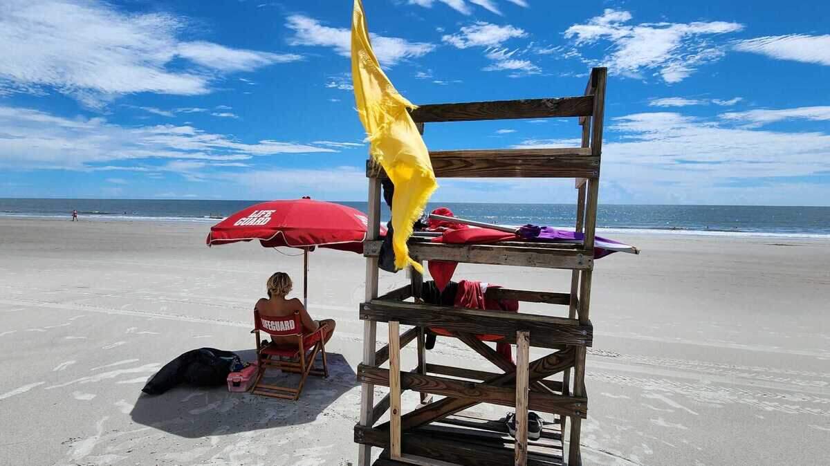 A yellow flag alerts beach goers on Hilton Head Island for rougher than average surf at Driessen Beach on Tuesday, Aug. 29, 2023 as Hurricane Franklin moves up the eastern seaboard and out to sea as Hurricane Idalia moves into the Gulf of Mexico.