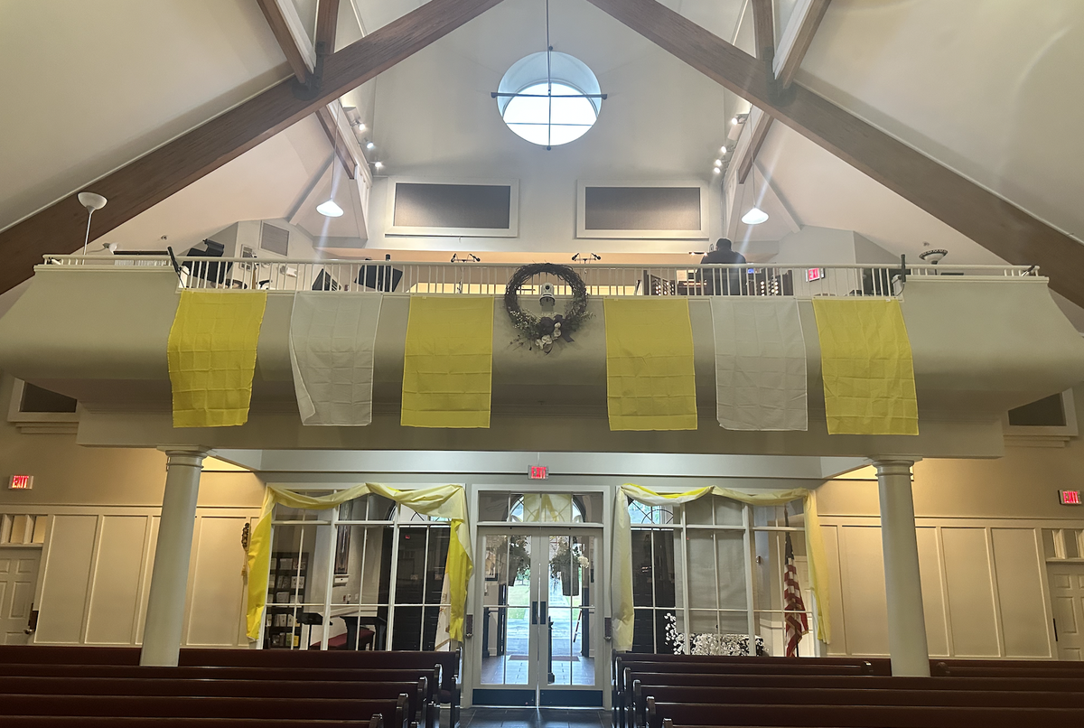 Yellow and white buntings were hung inside of St. Gregory the Great Catholic Church Thursday afternoon following the announcement of the newly-selected Pope. The colors white and yellow hold significant symbolic meaning in the Catholic Church and are featured in the Vatican flag.