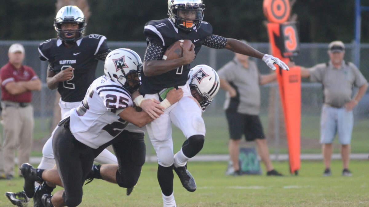 Bluffton's Cameron Bent gains some hard yardage during an Oct. 7, 2015 game with Wando. The Bobcats won the game that was rescheduled from the previous week, 46-32. Bent was injured in the game but finished with 17 carries for 260 yards. 