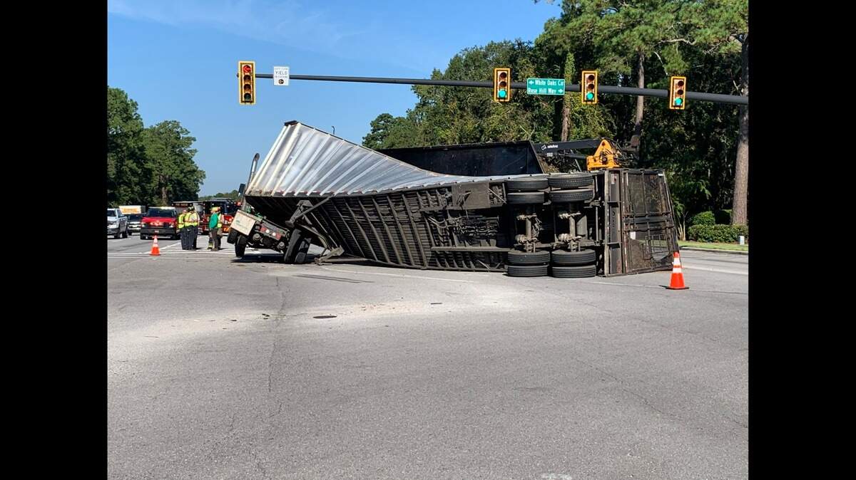 The overturned tractor trailer spilled mulch onto U.S. 278 near Rose Hill Plantation in Bluffton where it crashed. Authorities are working to clear the scene on Tuesday morning, Sept. 28, 2021.
