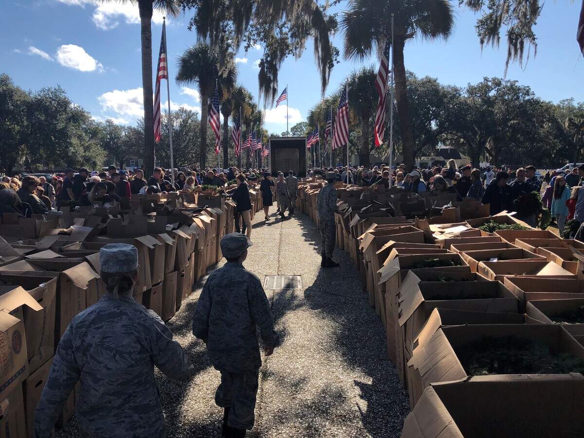 Cadets with the Lowcountry Composite Squadron of the Civil Air Patrol help hand out wreaths and break up boxes at the Wreaths for America event Saturday at Beaufort National Cemetery.