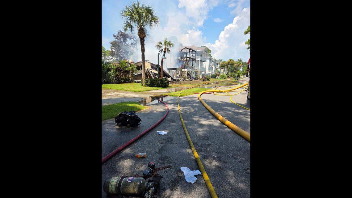 Crews mop up and investigate Saturday afternoon at a fire that destroyed three houses and damage others on Fripp Island.