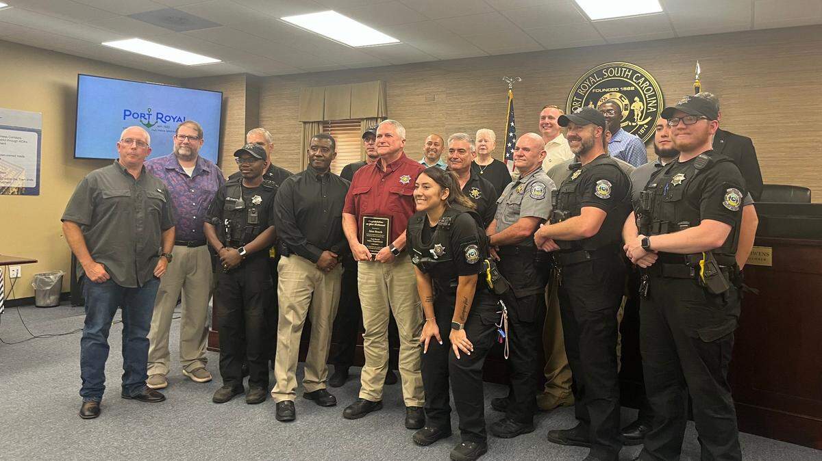 Members of the Port Royal Police Department and the Town Council said goodbye to retiring Chief Alan Beach Wednesday. Capt. Andre Massey, to Beach’s right, is a finalist for the job.