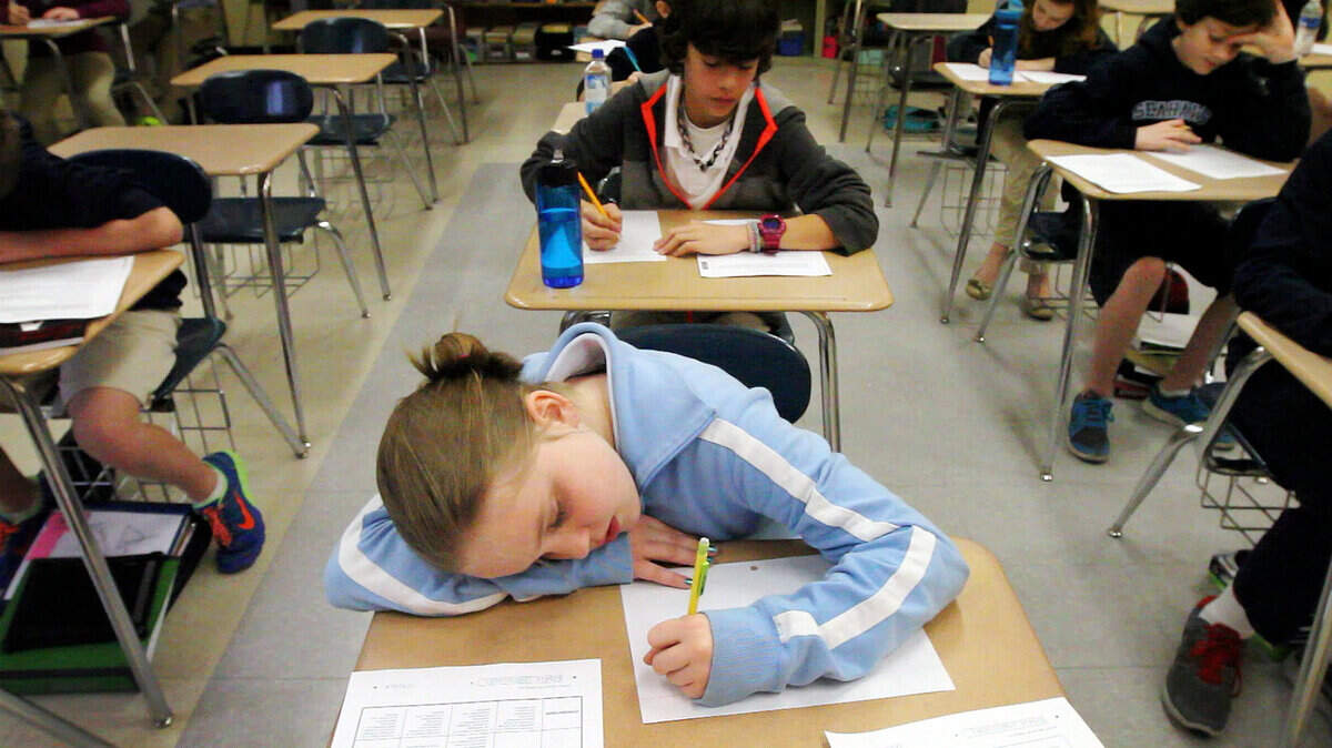 Hilton Head Island Middle School student Eleanor Rosenberry, center, works during a practice PASS test in the class of English teacher Kathleen Clark on March 6, 2014. All grades take the English, Writing and Math sections while select grades take the science or the social studies. This is the state-developed test to measure if students are meeting the state's standards. 
