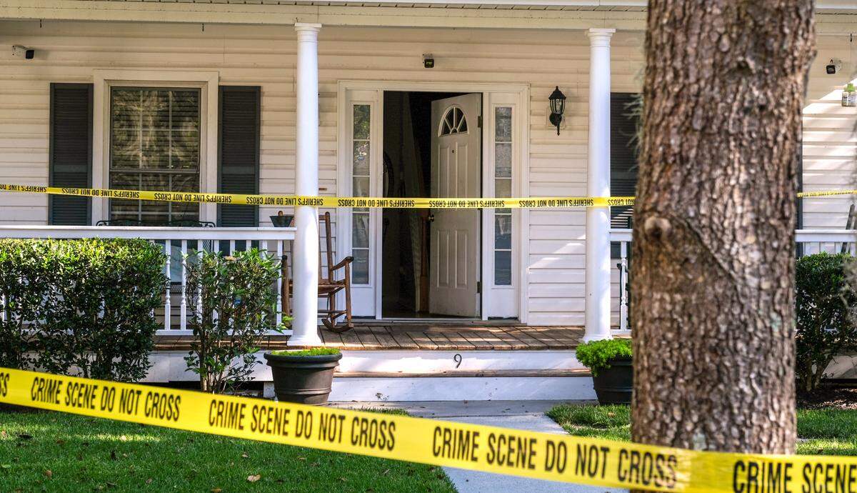 Security cameras cover the entrance of a home surrounded by crime scene tape on Tuesday, Nov. 17, 2020 at a homicide investigation in the gated-community of Westbury Park in Bluffton. Police responded to the home on Monday night after receiving a call of shots fired and found 45-year-old Timothy Milliken dead.