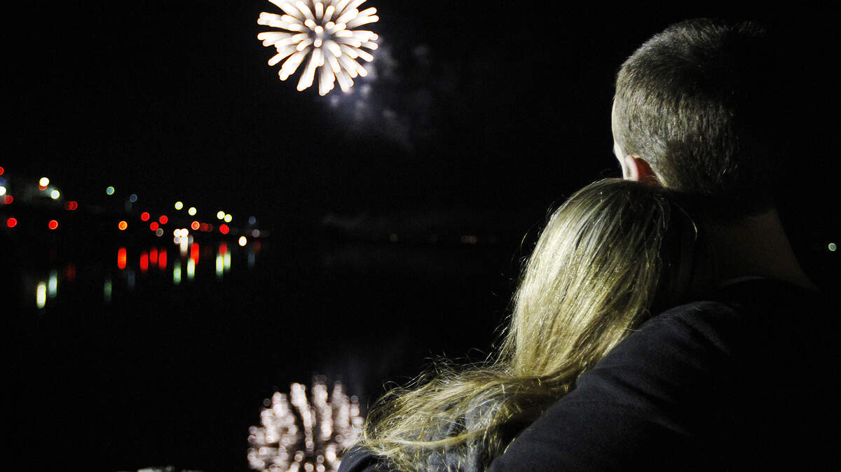 Devin Garrett, of Beaufort, holds Maggie Gosiger, of Cincinnati, in his arms while watching the fireworks from Waterfront Park during the Founders’ Night Fireworks in Waterfront Park presented by the Beaufort Regional Chamber of Commerce in partnership with the City of Beaufort on Dec. 31, 2014.