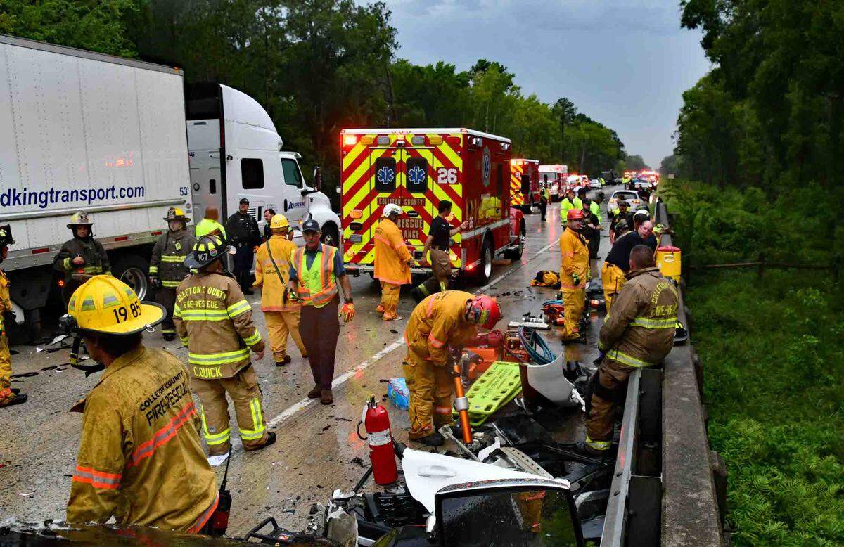 First responders set up a triage area on I-95 after a deadly pileup involving over a dozen cars and trucks in rural Colleton County the afternoon of July 22, 2025. Twenty-six people injured in the crash were treated on scene, officials said. About 10 people were taken to hospitals and trauma centers around the Lowcountry.