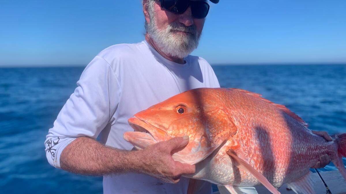Brother Dan had to release his first-ever red snapper, but just holding it was enough.