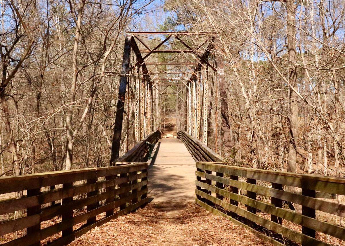 The Key Bridge is your “key” to a day of adventure on the Turkey Creek Trail in the Sumter National Forest. This 13 mile out-and-back trail near Augusta begins at this historic steel bridge, built in 1912 and named for Henry Key, one of the original European settlers in the area. Now a footbridge, it is part of the South Carolina Rails to Trails hiking and biking trails program. You cross Key Bridge as you begin a moderately challenging hike through hardwood forest along Turkey and Wine creeks.&nbsp;