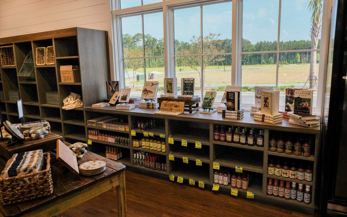 A back wall houses a local author section and other gifts as well as barbecue and hot sauce at Lowcountry Fresh Market and Cafe located along Buckwalter Parkway in Bluffton.