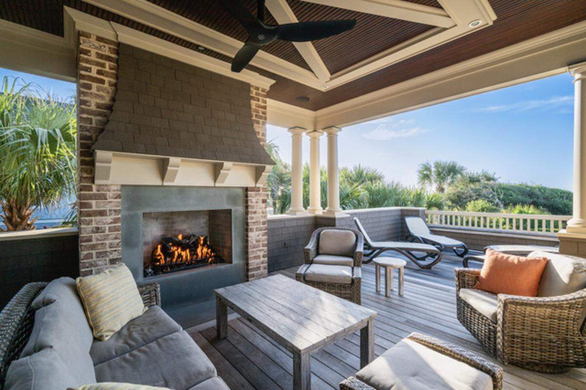 The newly listed home on Kiawah Island features an outdoor fireplace and two large outdoor showers.