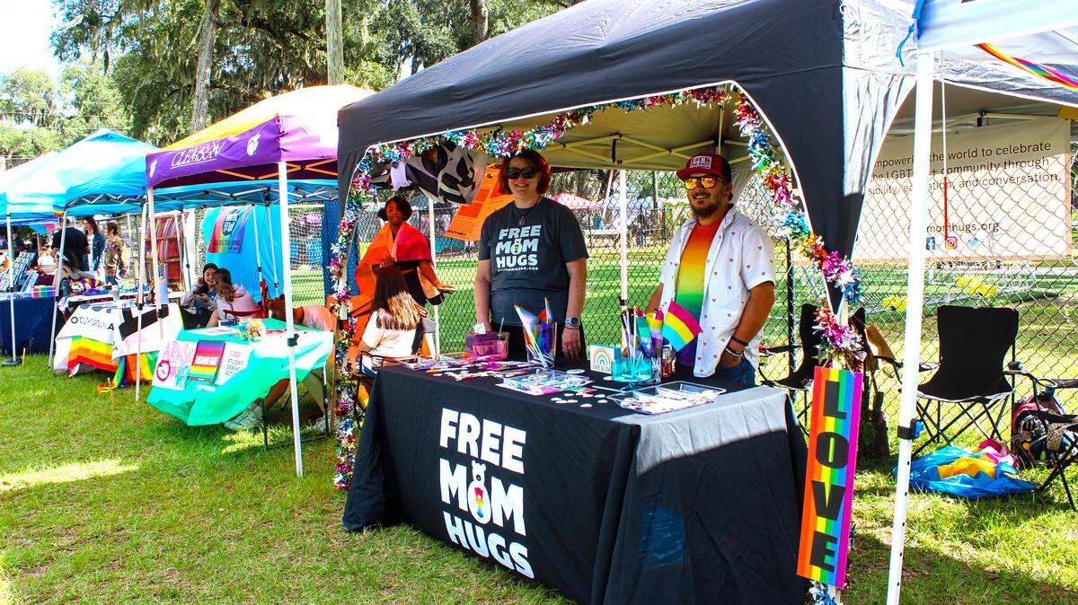 A “free mom hugs” booth at Lowcountry Pride Celebration in Port Royal offers hugs to anyone that needs one. When people come out, Beaufort local Brigid Fackrell (left) said it’s important to “be there” for them.