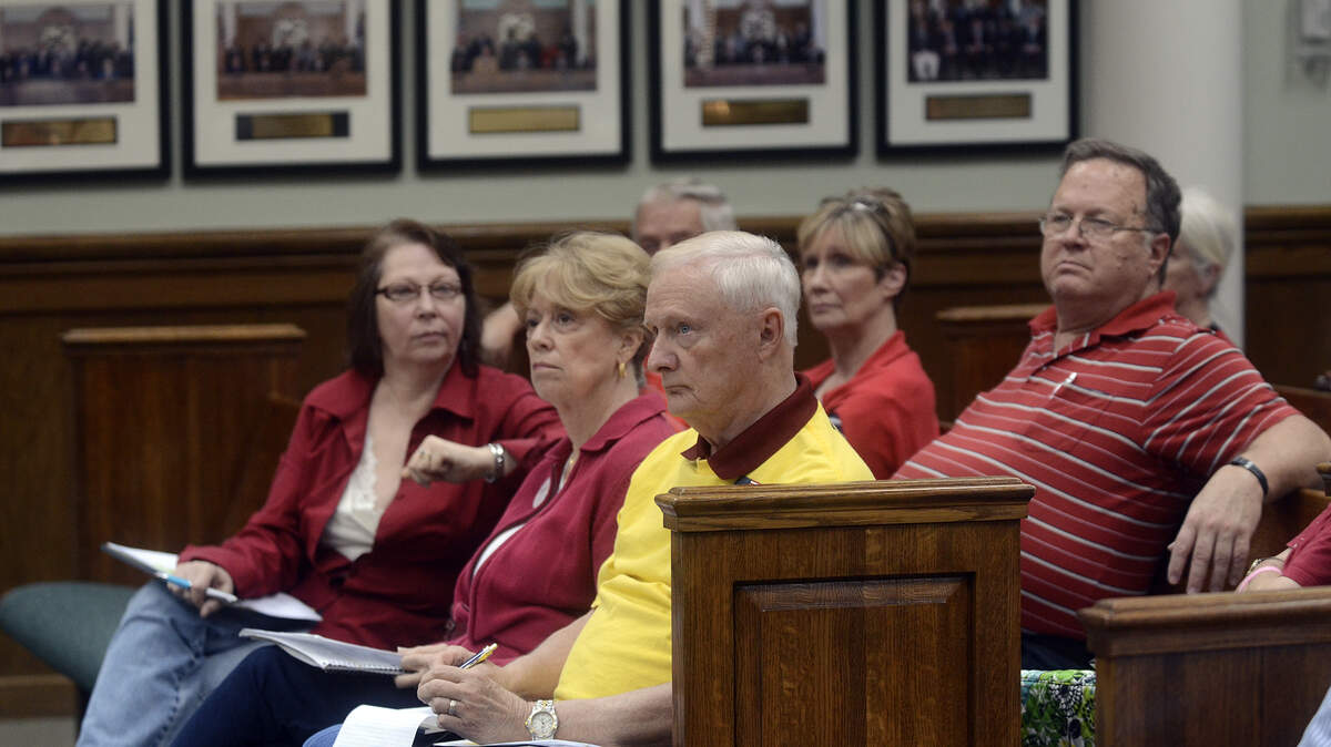 FILE: Members of the Beaufort Tea Party listen during the Capital Sales Project Commission's first meeting in the County Council Chambers the evening of April 10, 2014, in Beaufort.