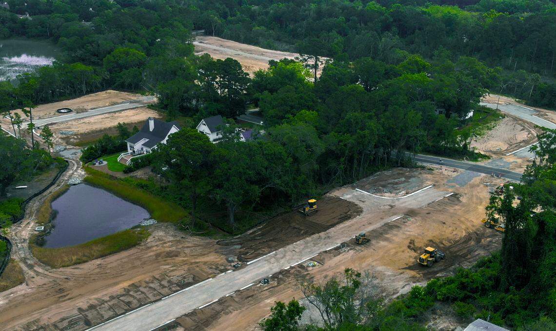This photo taken with a drone on May 10, 2023 shows a forested area with residential properties enveloped by land clear cut for a future housing development off Jonesville Road on Hilton Head Island.
