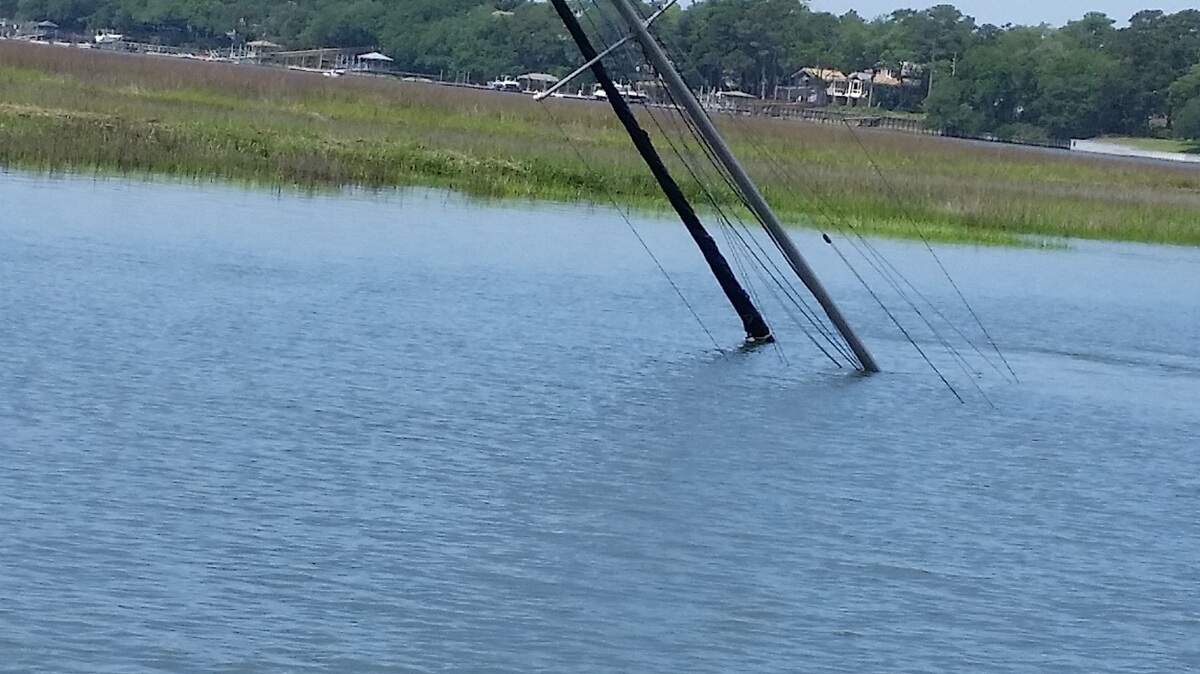 A boat that had been stuck in the marsh in Broad Creek on Hilton Head Island has capsized.