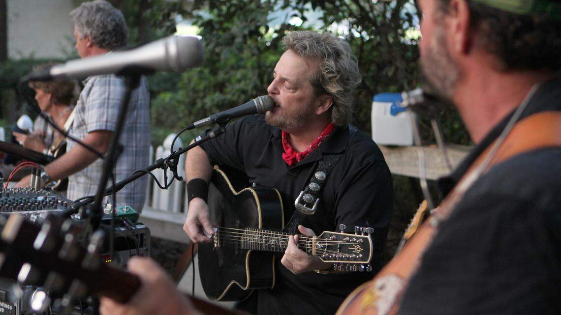David Wingo sings during his performance with fellow musicians Jesse Watkins and Mike Wilson on Friday night at on the deck at the Black Marlin Restaurant at Palmetto Bay Marina on Hilton Head Island.