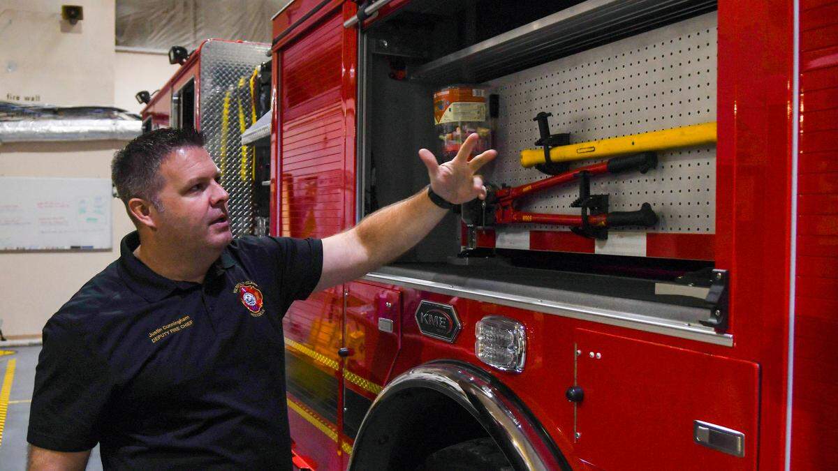 Hilton Head Island Fire Rescue Deputy Fire Chief Justin Cunningham explains how every piece of equipment is in the same compartment for every truck enabling firefighters to respond efficiently when responding to an emergency on Aug. 1, 2024 in the service bay at headquarters on Hilton Head.