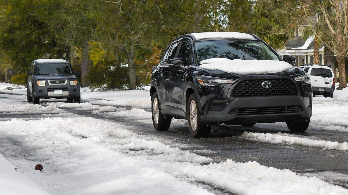 Snow that melts and re-freezes — known as black ice —looks like asphalt that can fool drivers into believing roadways are clear. This photo taken on Jan. 23, 2025 in Savannah, Ga. Shows the slushy mixture after Winter Storm Enzo brought snow and ice to the southeast coast.