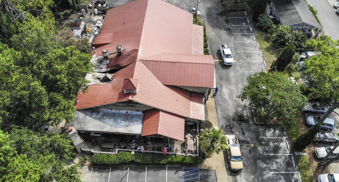 A mechanical unit caved in a portion of the roof to Hilton Head Island’s The Smokehouse restaurant as seen in this drone photo on Monday morning, the day after the fire. The fire, which began near the exterior wall, started early Sunday morning and according to fire officials, is not deemed suspicious.