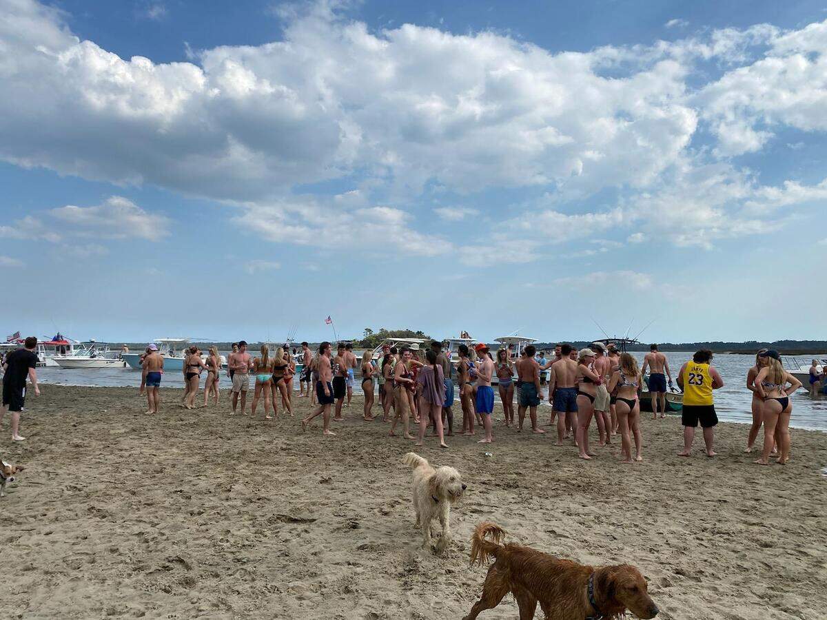 Crowds gathered at the sandbar in the May River near Bluffton on Saturday after Hilton Head Island beaches were restricted for coronavirus.