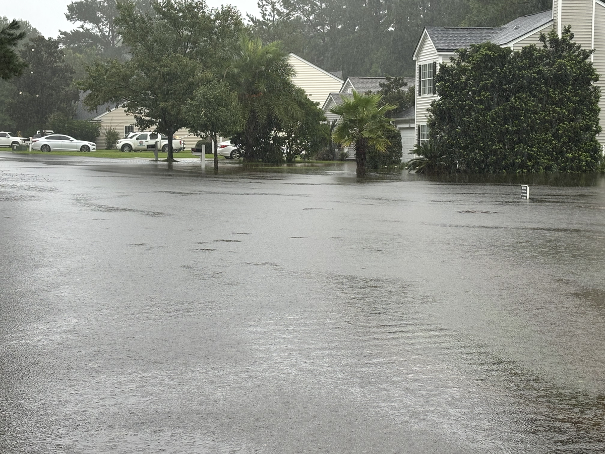 A photo taken on Cattle Run Way in The Farm at Buckwalter, a large neighborhood of townhomes in southern Bluffton, shows the roadway blanketed with water as Tropical Storm Debby continued its deluge in the Beaufort County area.