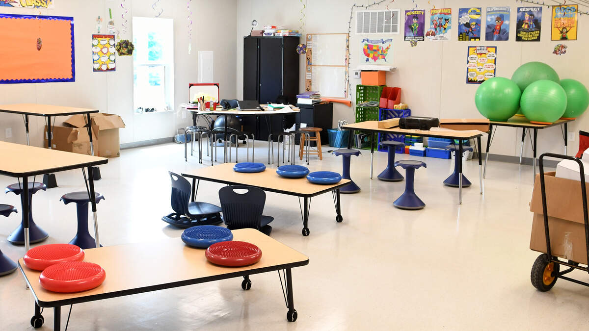 A classroom in the mobile classroom building is prepped and waiting for fifth grade students at Pritchardville Elementary. The school offers their students a wide variety of flexible seating options – from bean bag chairs to stool-like chairs. The mobile is structured more like a traditional brick and mortar building with classrooms on both sides of a central hallway.