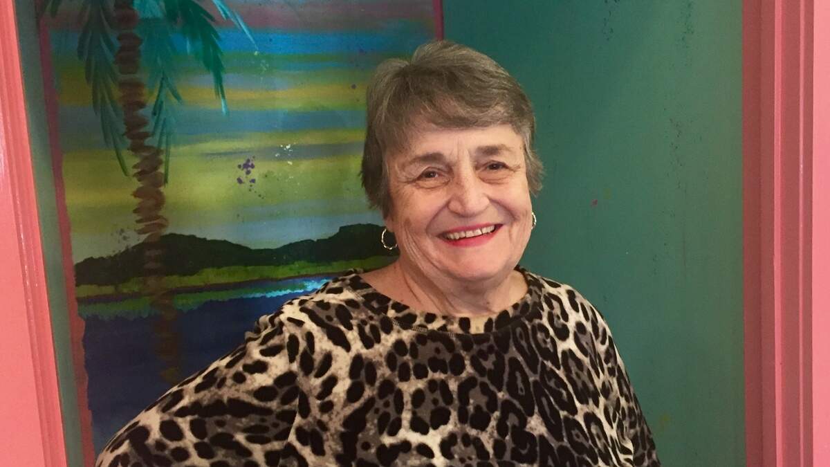 Nancy Voegele poses in the Pink House Gallery at Main Street Village on Hilton Head Island.