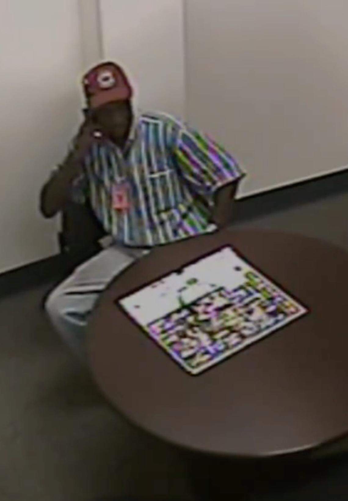 Isaiah Gadson makes a call on Aug. 11, 2016, from an interview room at the Beaufort Police Department after being put under arrest for the 1980 murder of David Krulewicz and the rape of David’s girlfriend, Susan Weed, on Old Salem Road, just outside of Beaufort.