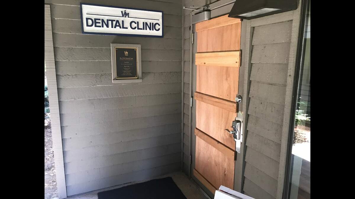 The wooden door at the front of the VIM Dental Clinic on Wednesday.