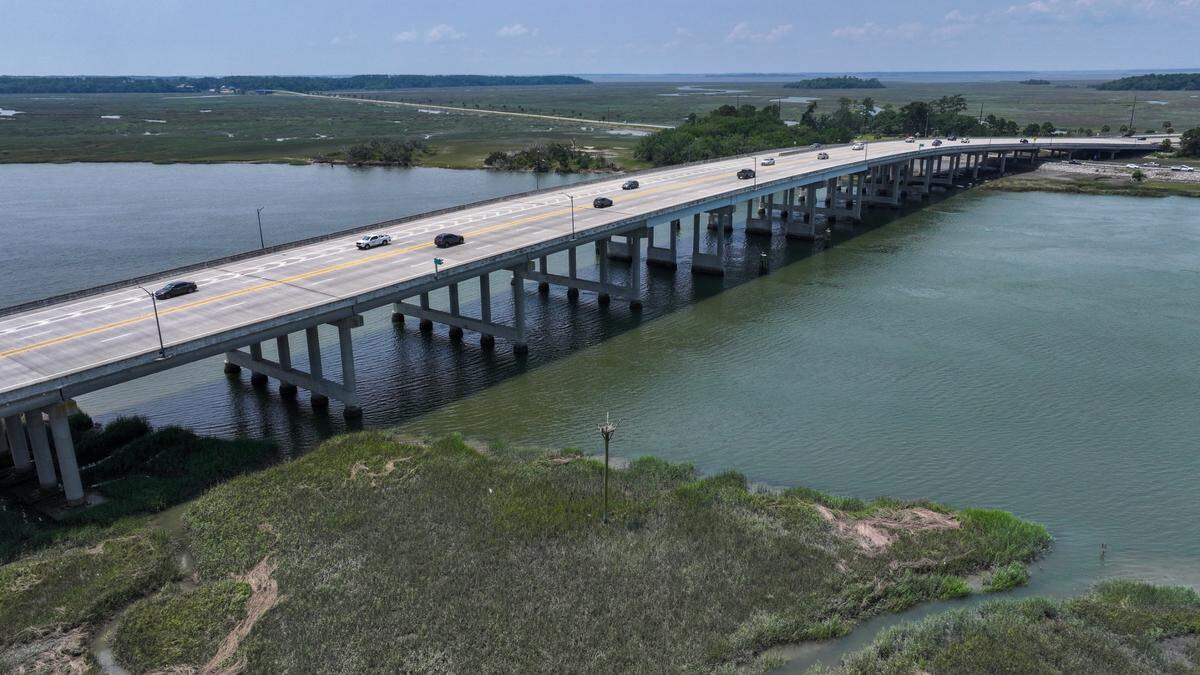 Traffic moves along the Russell Bell Bridge on June 3, 2025, over Battery Creek in Port Royal, SC. Malecon Drive, the palm tree-lined road that leads to Marine Corps Recruit Depot on Parris Island, can be seen at the top left of the photo.