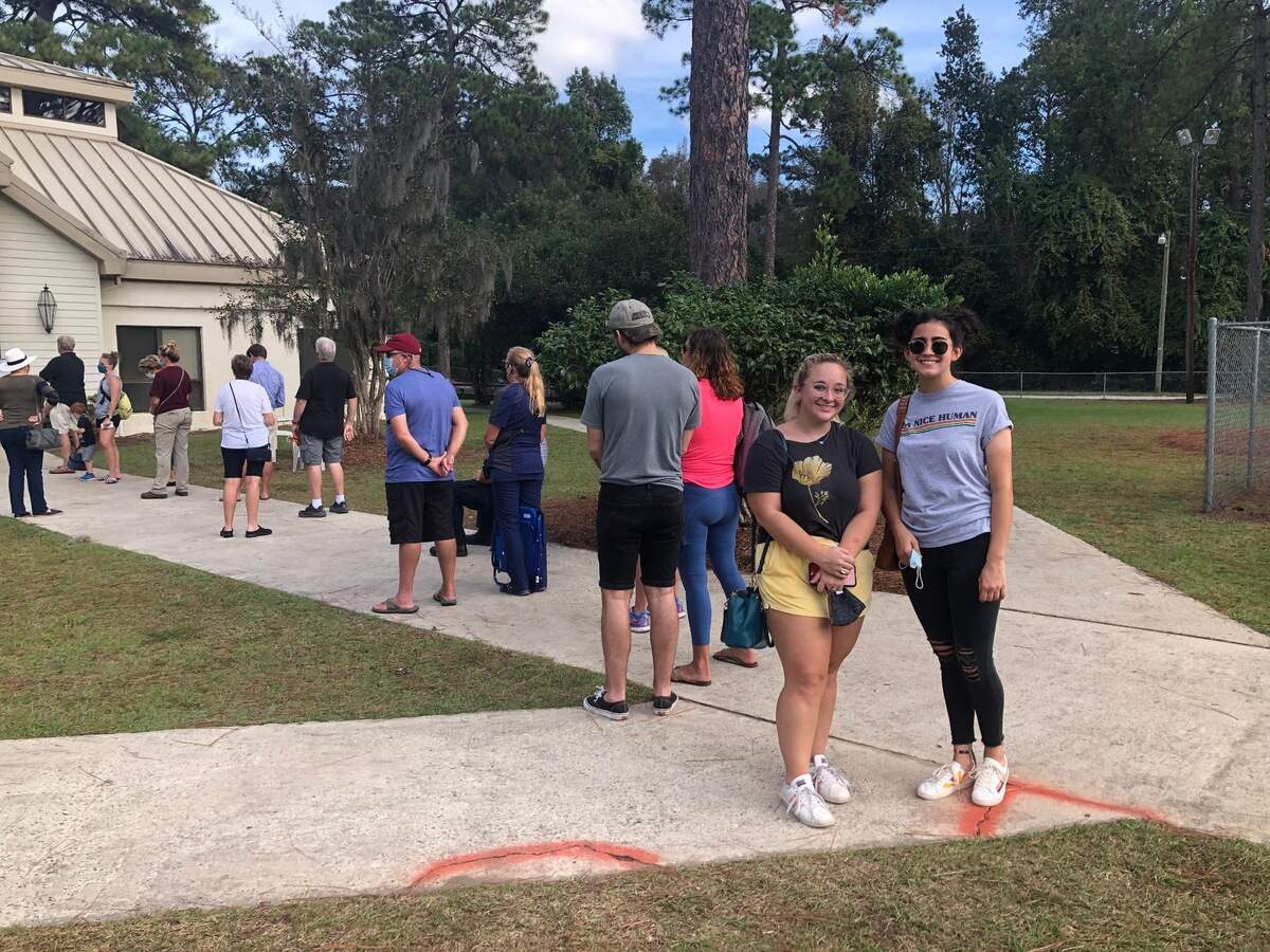 Taylor Beggan, 24, and Cassidy Mannel, 23, near the front of the line to vote absentee in-person at Bluffton Recreation Center Wednesday, Oct. 28.