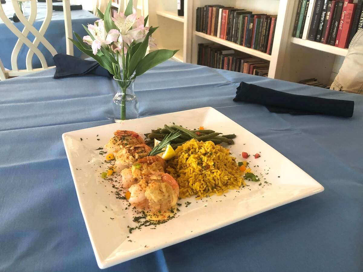 Stuffed shrimp are served with saffron-vegetable rice and vegetable of the day at Bell’s at the Beach on Daufuskie Island.